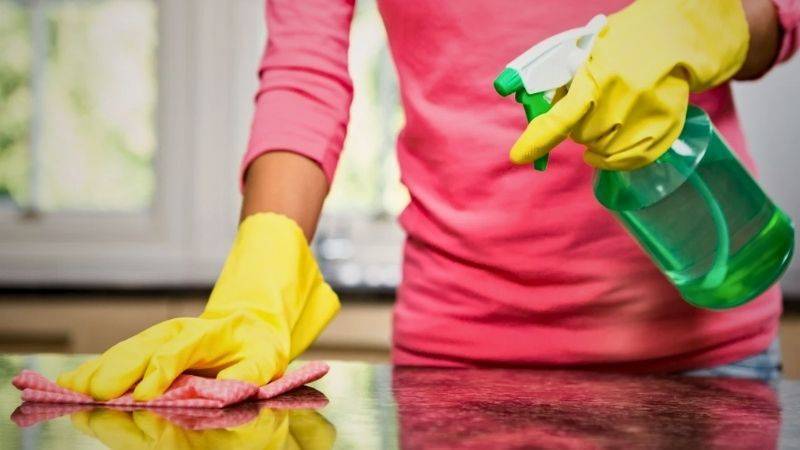 Clean countertops with disinfectant